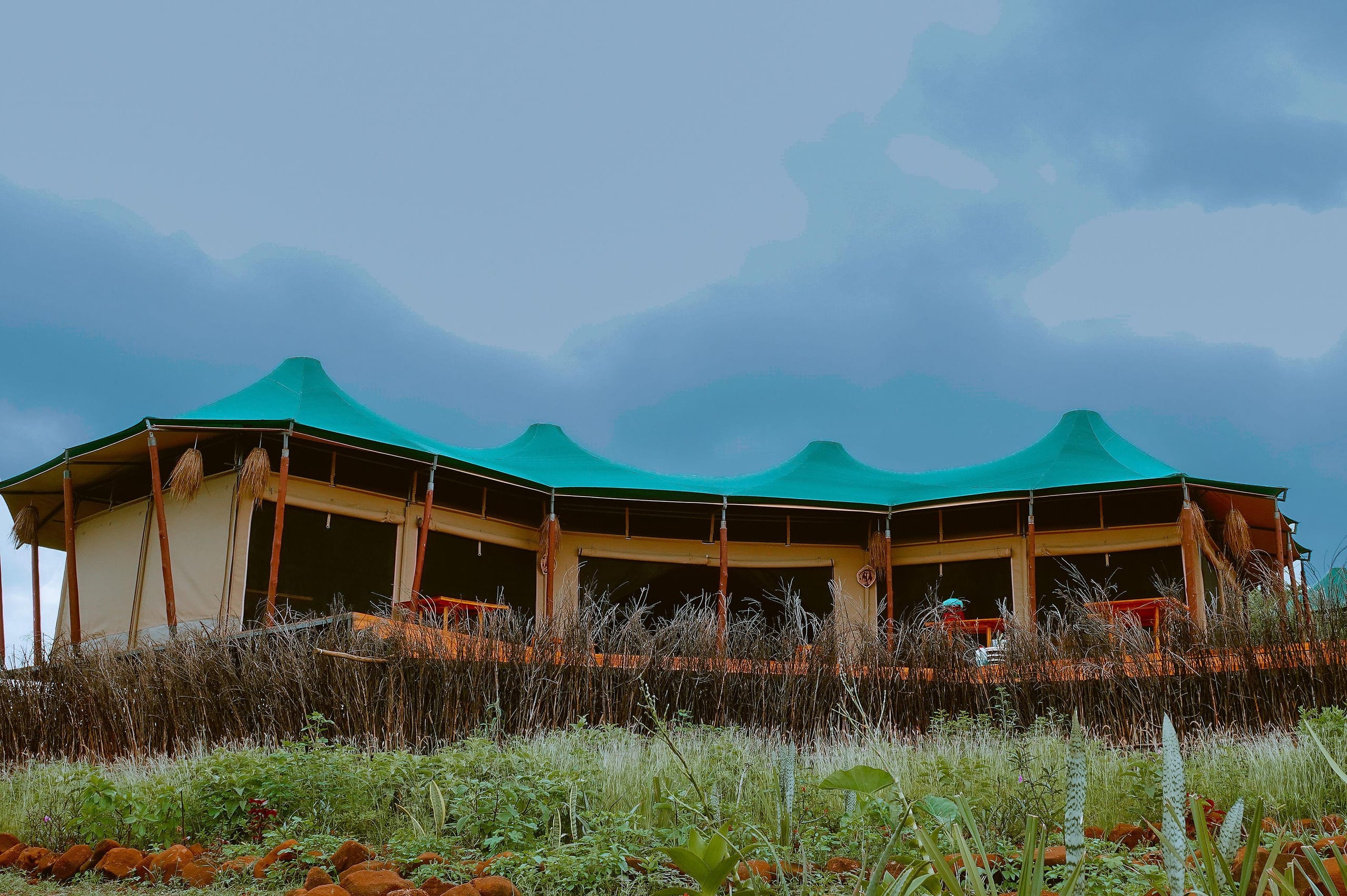 The main pavilion in daylight, joined peaks against the sky