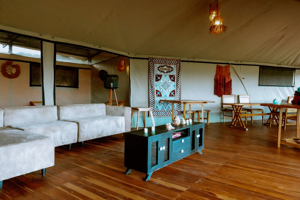 Lounge interior with tribal hangings and woven console